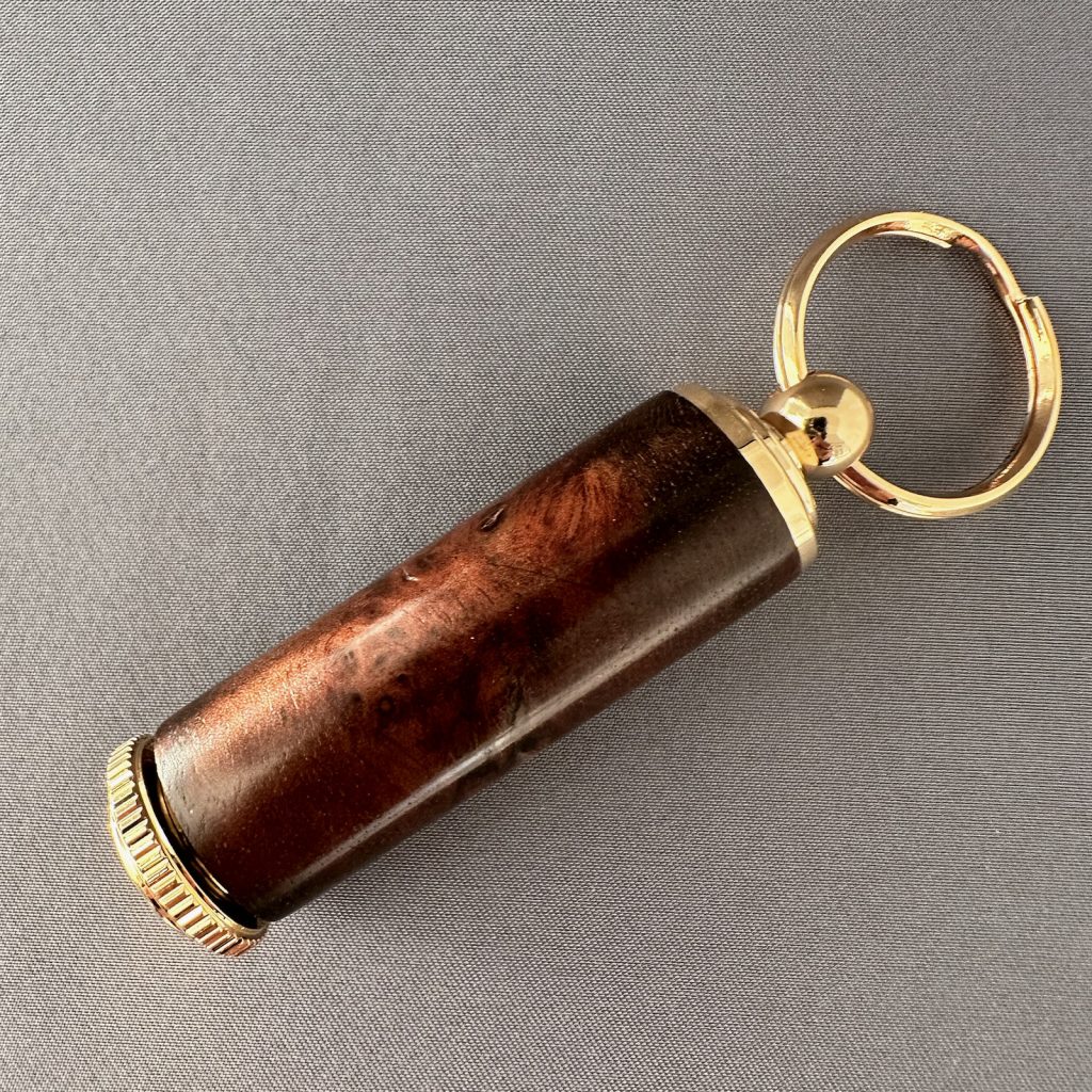 Hand-turned burl wood pill holder keychain with 10K gold hardware