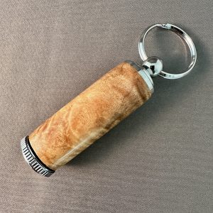 Hand-turned maple burl pill holder keychain with polished chrome hardware