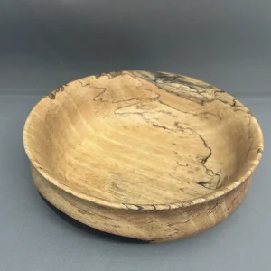 Angled view of hand-turned Spalted Tamarind bowl showing its interior and curved profile