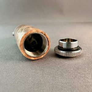 Close-up of pill holder interior, threaded cap, and rubber O-ring