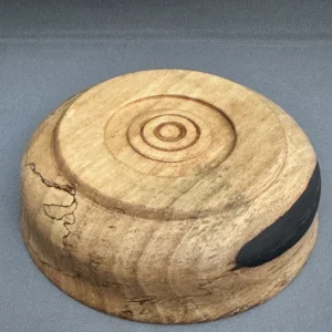 Underside of hand-turned Spalted Tamarind bowl showing its foot and natural wood patterns