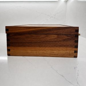 Side profile of the solid-wood Shut the Box game showing contrasting box joints
