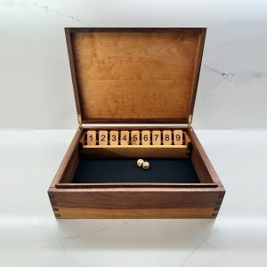 Open handcrafted Shut the Box game with numbered wooden tiles, dice, and brass hinges