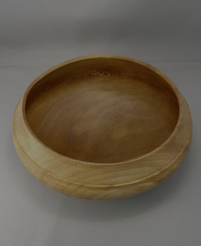 Sycamore calabash bowl showing the hand-turned interior and natural wood grain