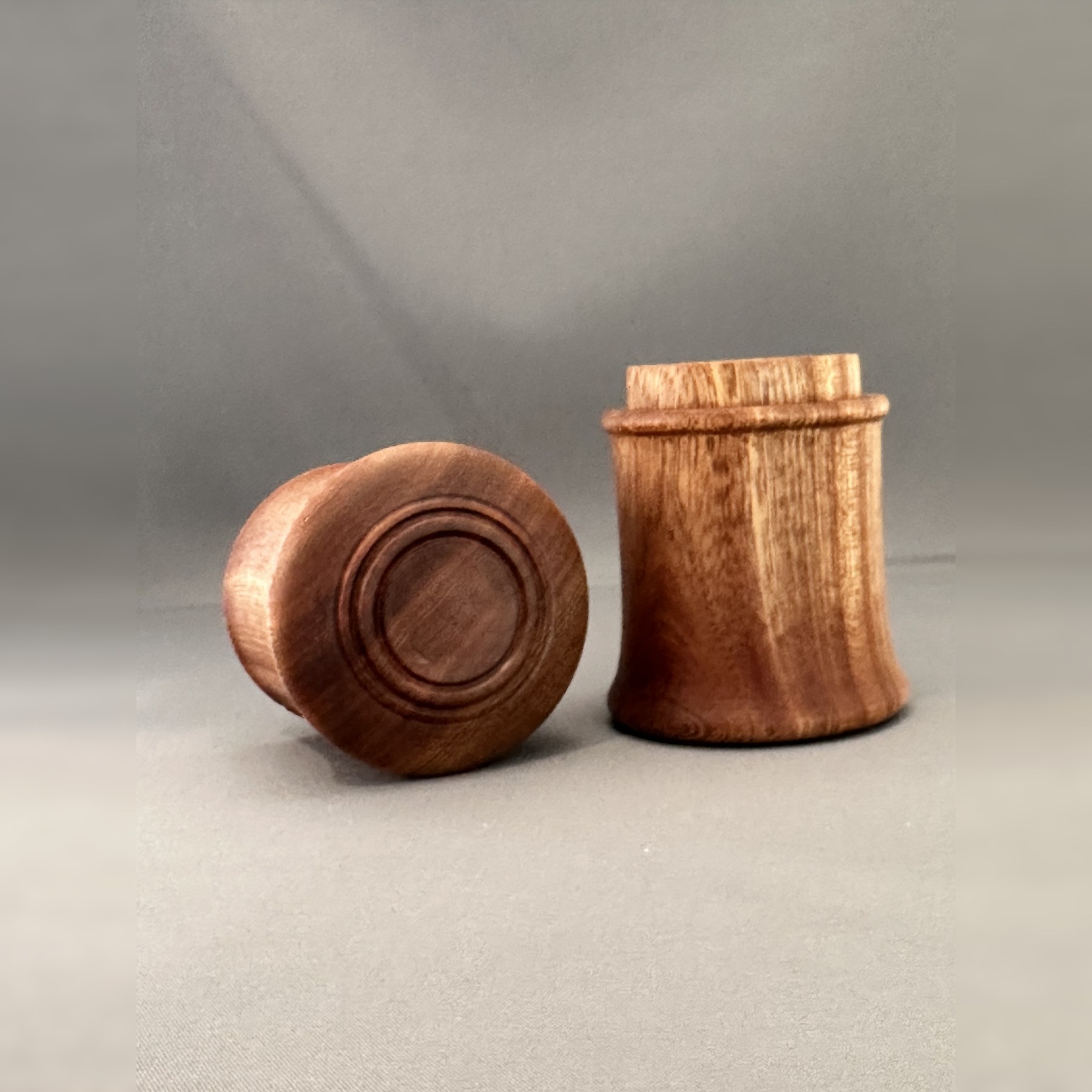 Open Sipo mahogany keepsake box with the detailed lid resting beside it