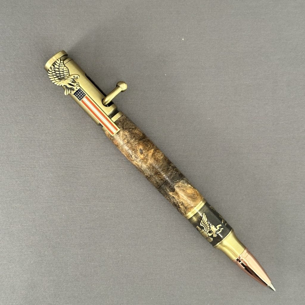 Liberty Burl buckeye burl bolt-action pen with antique-brass bald eagle and American flag hardware