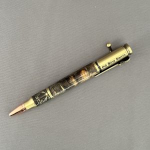 Reverse side of Liberty Burl showing the God Bless America engraving on the antique-brass cap