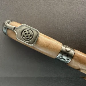 Close-up of the antique pewter paddle-shaped clip and pickleball-decorated center band on a maple pen.
