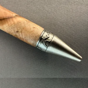 Close-up of the maple pen’s antique pewter tip and decorative band featuring pickleball player silhouettes.
