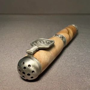 End-on view of the maple pen’s rounded antique pewter pickleball cap, with its paddle clip visible behind it.