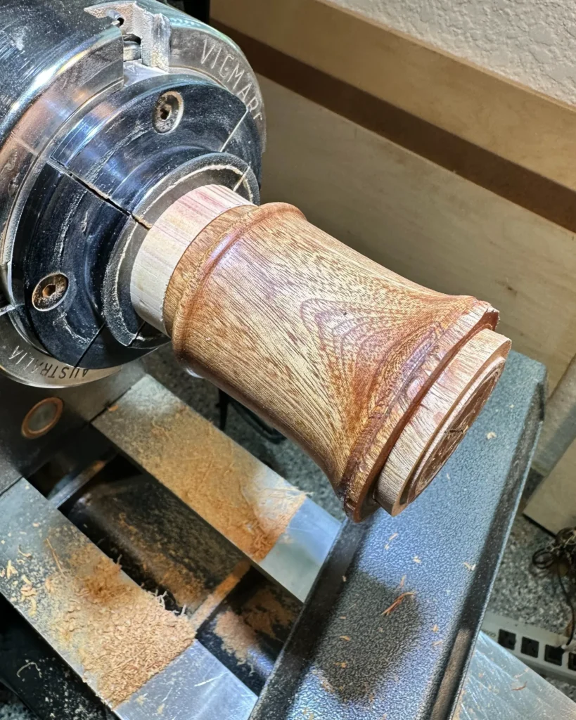 Inner Sanctuary’s box body mounted on a scrap-wood jam chuck, with its unfinished bottom exposed.