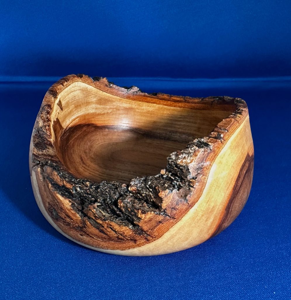Opposite view of the Second Chance cherry bowl with a rugged live-edge rim