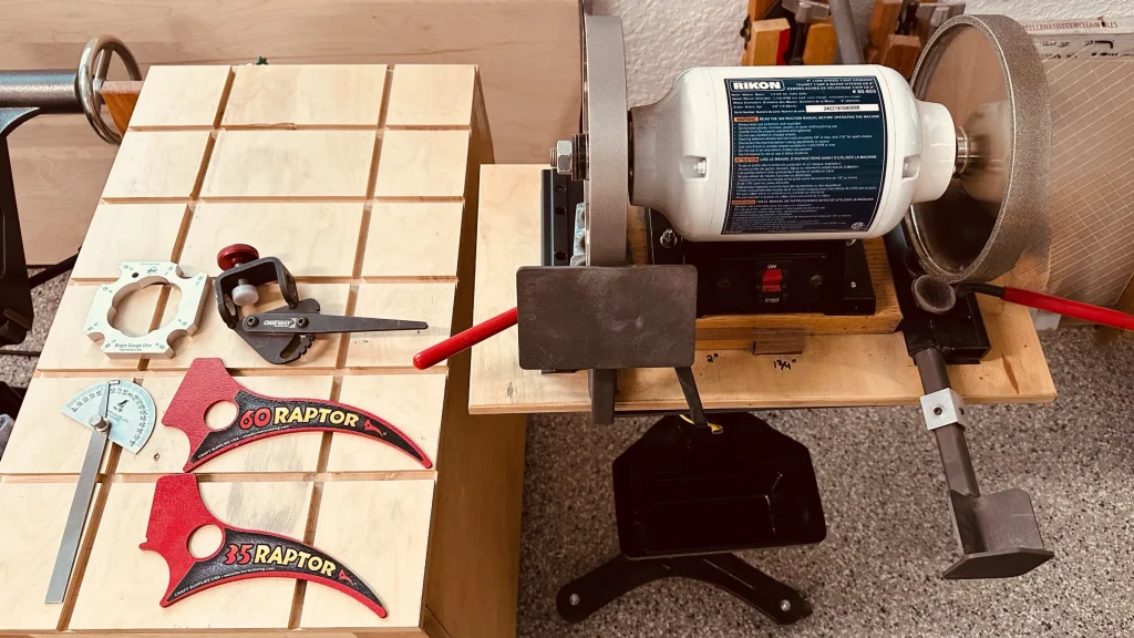 Rikon grinder with two CBN wheels and Wolverine supports, beside Raptor setup tools, angle gauges, and a sharpening jig.